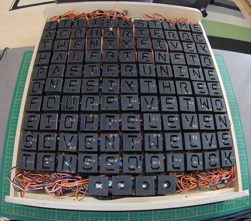 This incredible word clock is controlled by 114 servos Arduino Blog