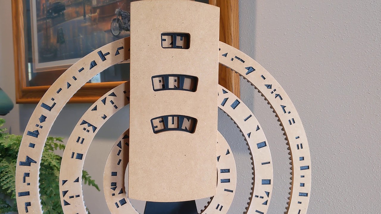 This perpetual calendar displays the date, month, and day using cryptic rings