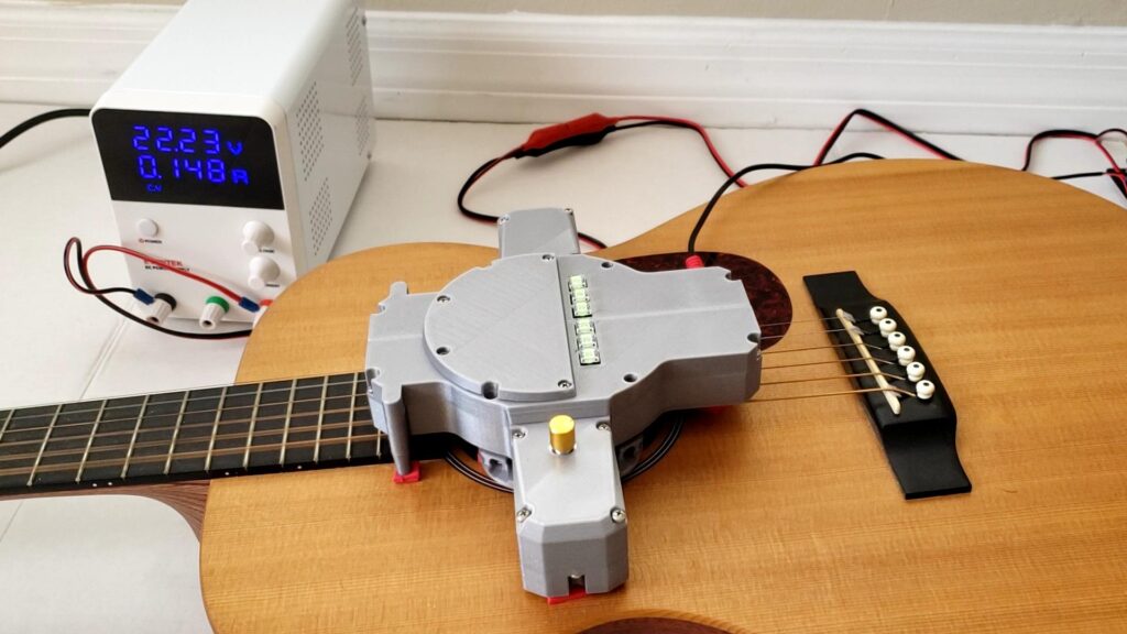 DIY device that strums your guitar 