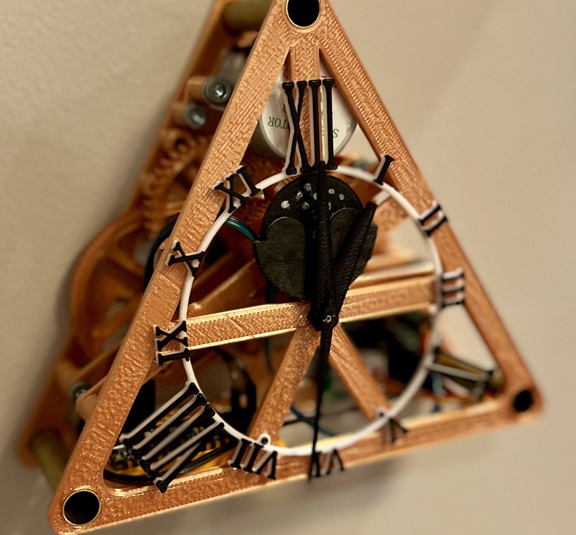 This 3D-printed, three-sided clock tells time with three hands
