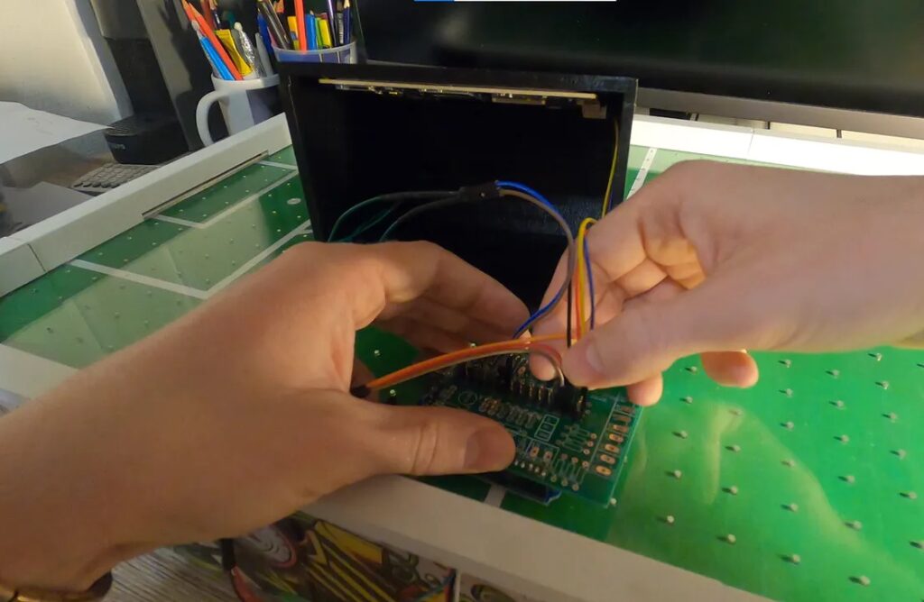 This homemade table puts a soccer spin on air hockey