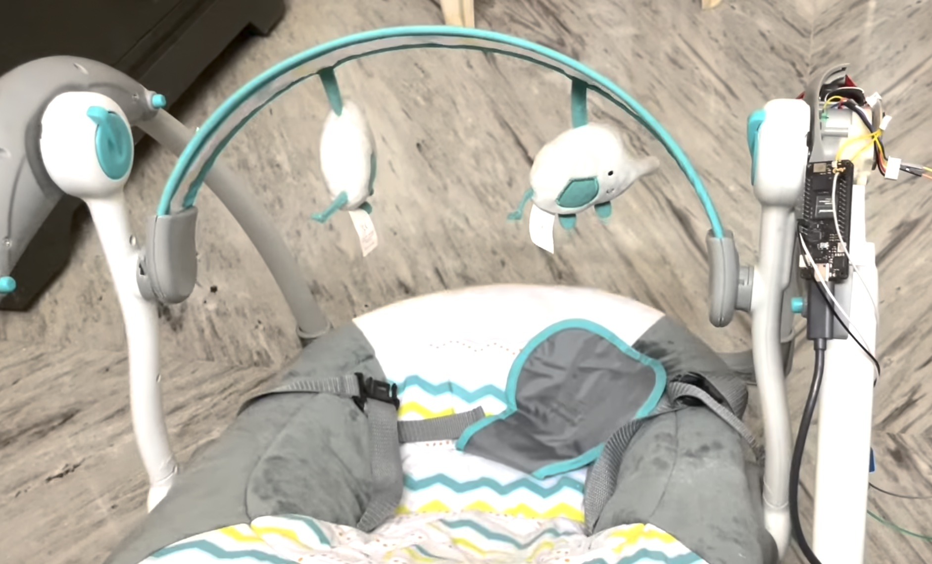 This TinyML powered baby swing starts automatically when crying is detected