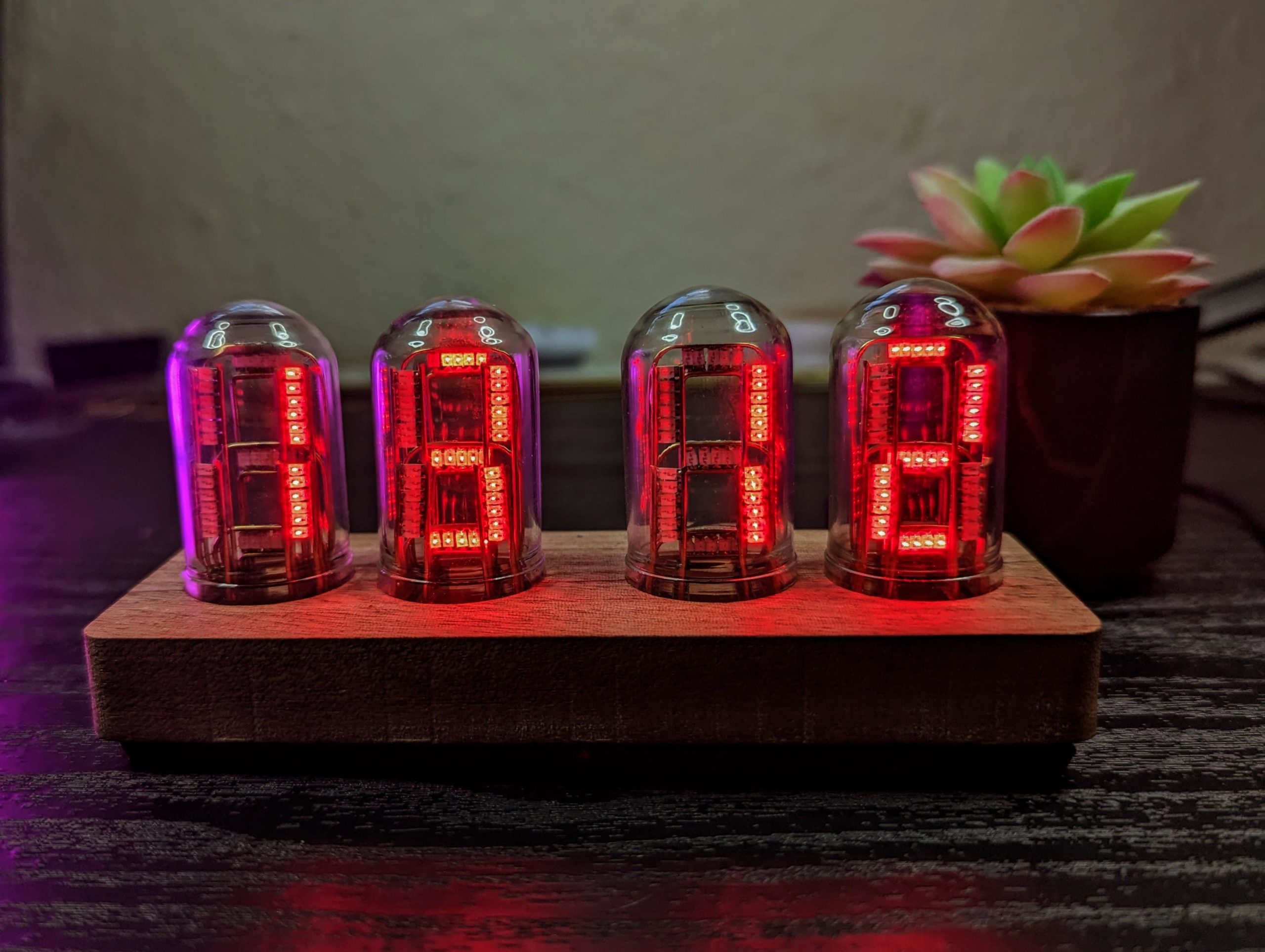 This beautiful clock features circuit sculpture faux Nixie tubes