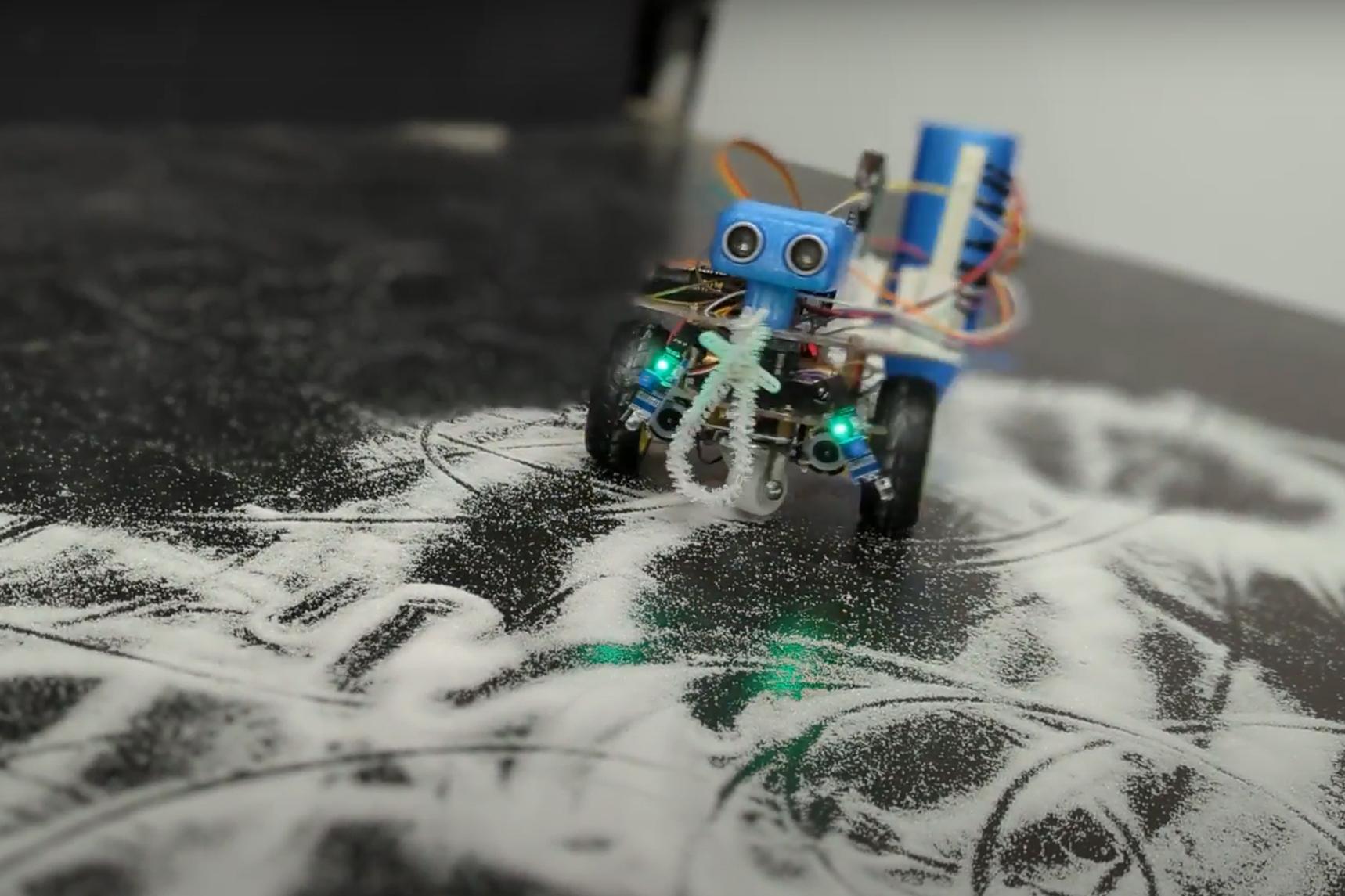 The Whimsy Artist is a small robot that both creates and destroys art