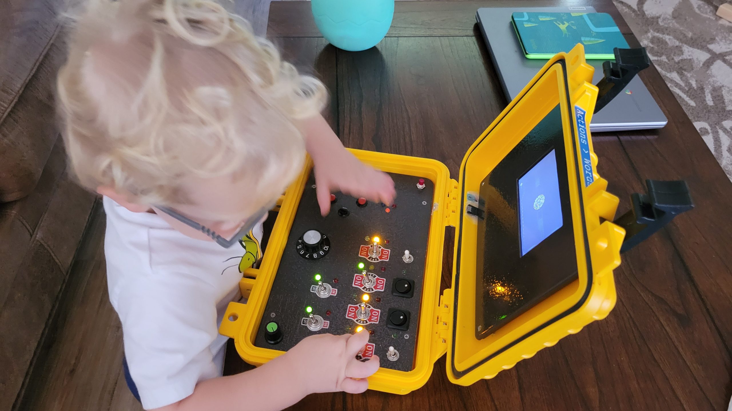A toddler receives a personalized cyberdeck