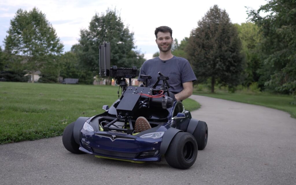 Tesla riding best sale lawn mower