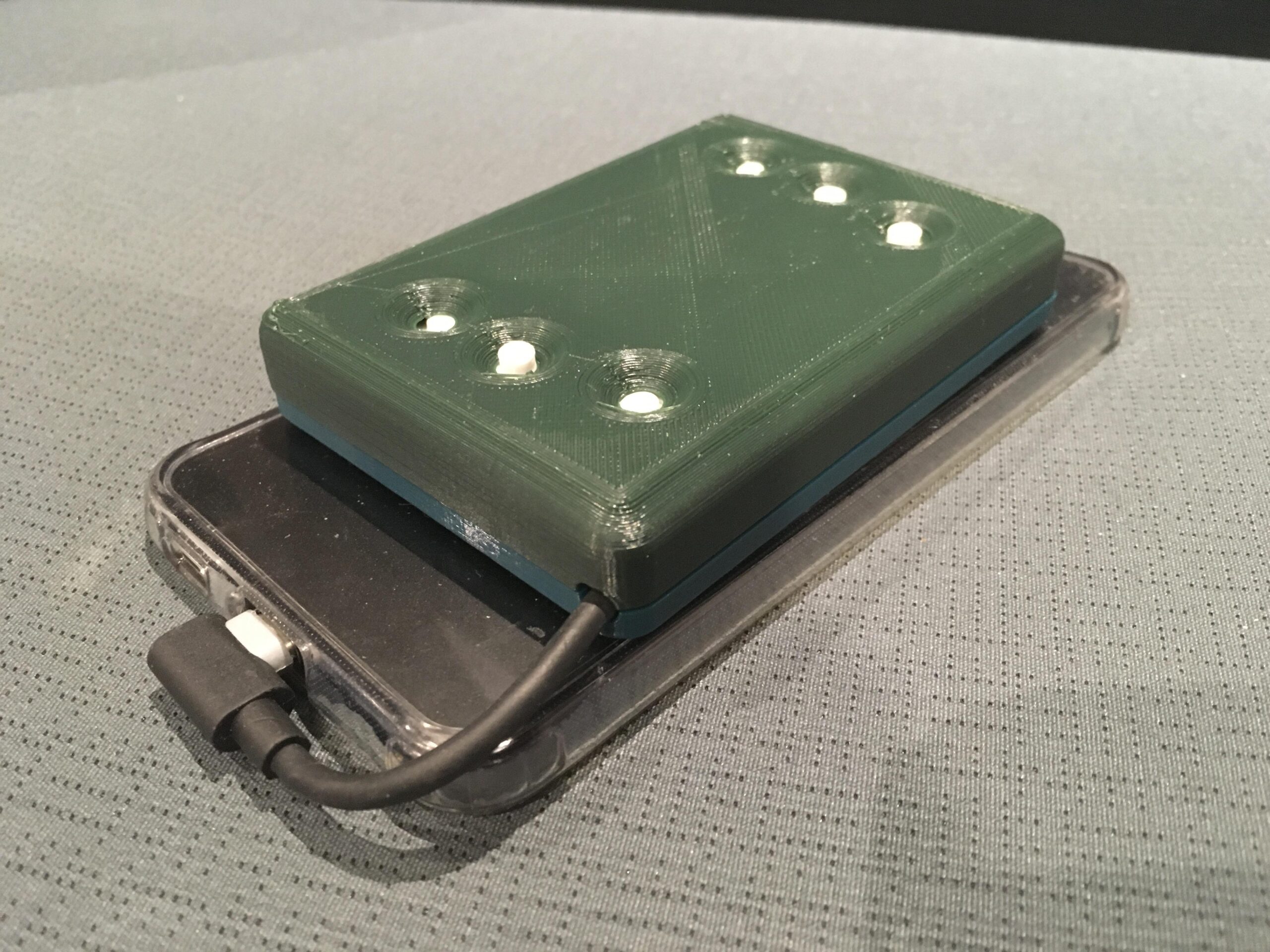 This small device allows users to feel Braille using haptics