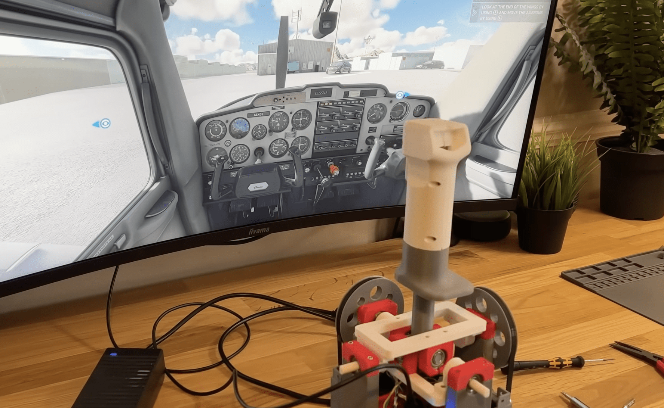 This custom flight joystick provides force feedback with stepper motors